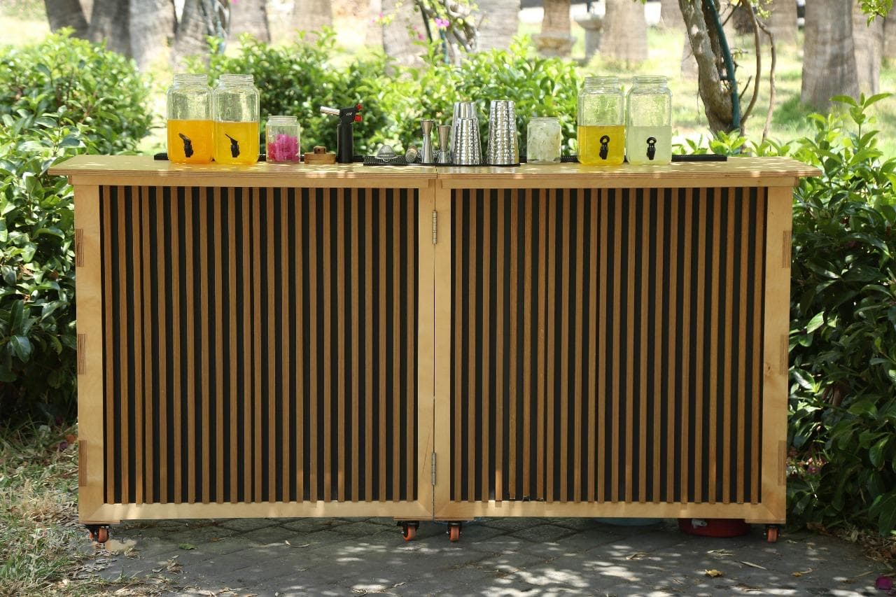 The Kaizen Station foldable bar set up for an event — hero shot